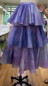 Purple tiered skirt on a mannequin in an indoor setting